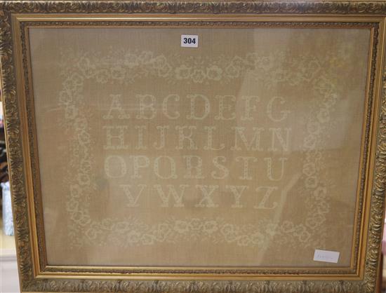 A gilt framed tapestry